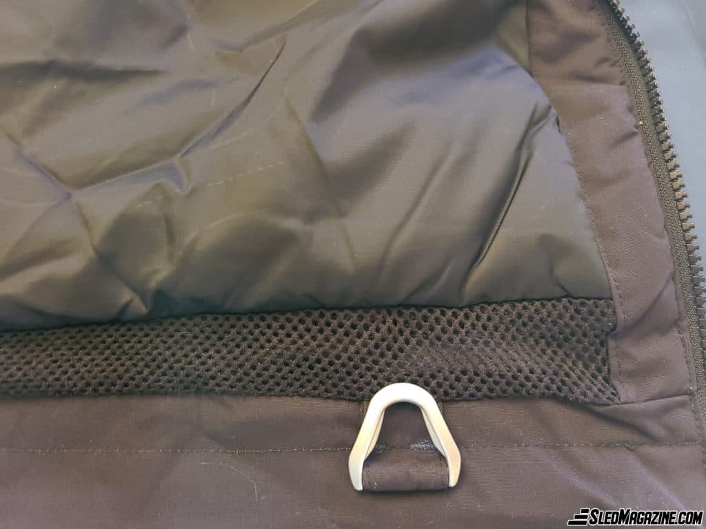 Metal D-ring to hang the snowmobile's cut-off cord.
