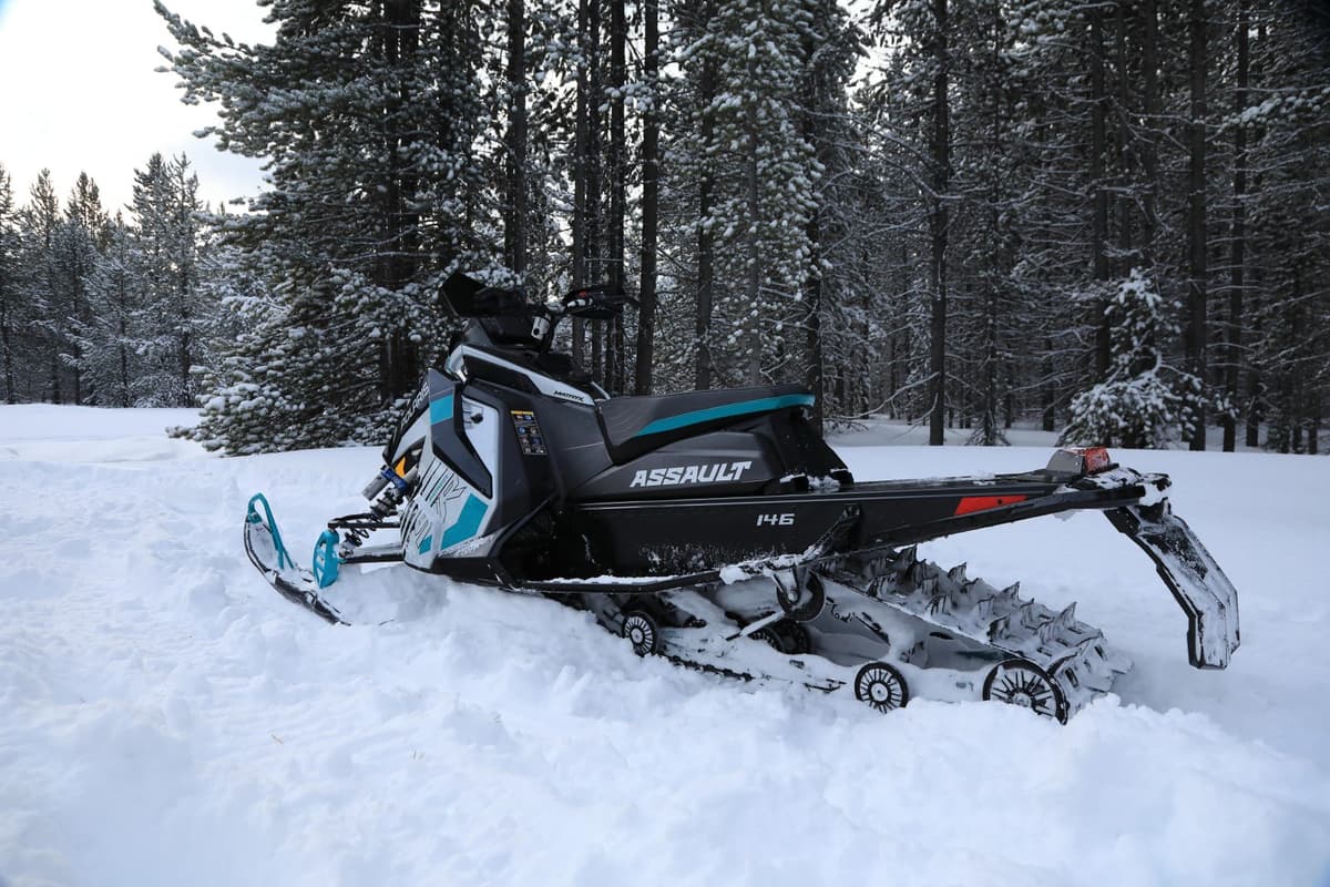 a switchback assault 2025 snowmobile in the snow