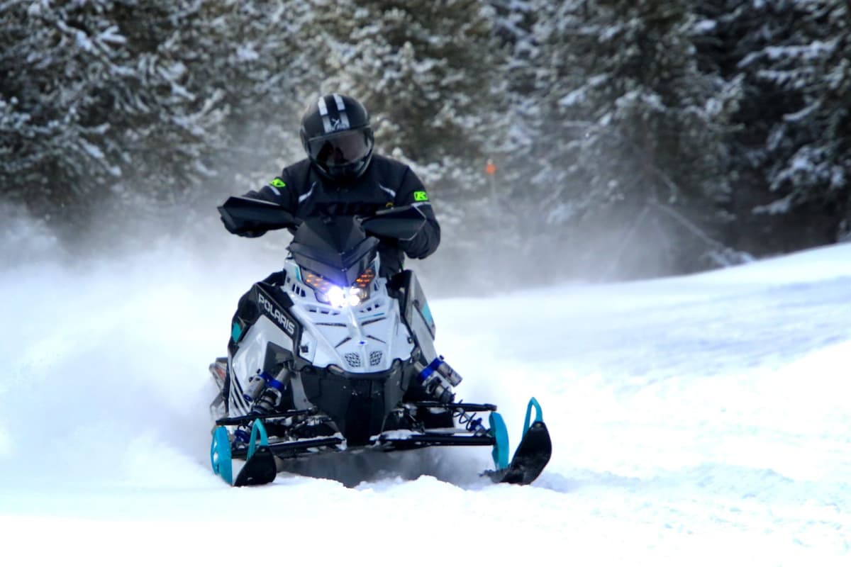 Person driving a polaris 2025 snowmobile
