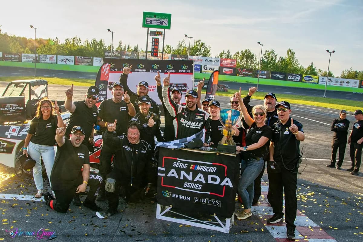 andrew ranger and his team with a first-place trophy at a NASCAR Canada series event.