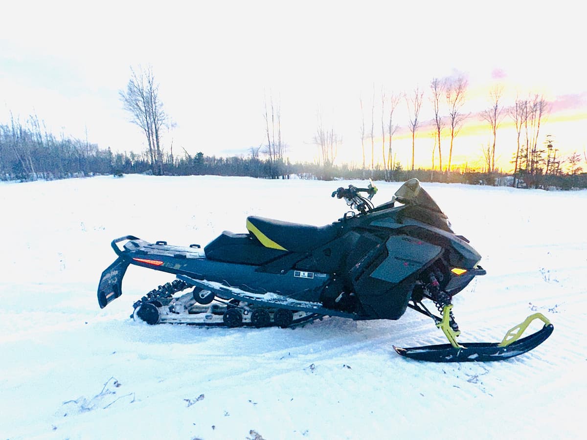 ski-doo renegade x-rs 2026 on snow at sunset